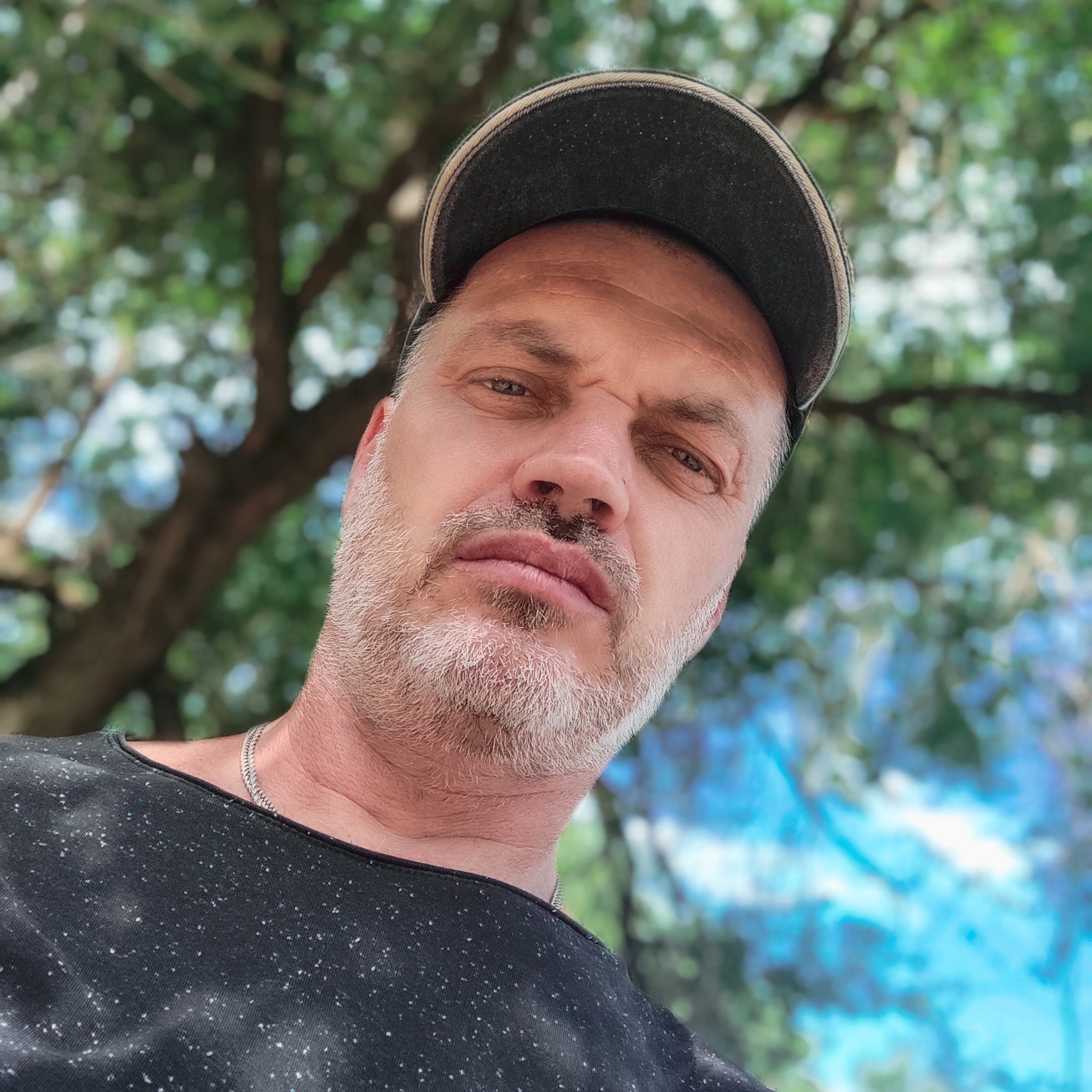 Satisfied male client of The ADU Guy LA holding keys after ADU completion in Los Angeles